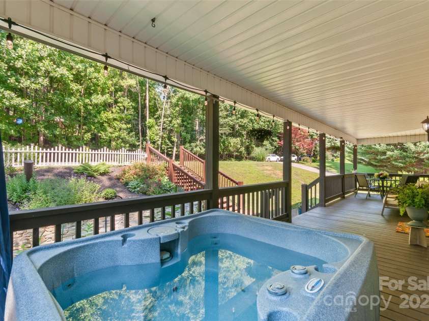 28 Grove Garden Avenue, Candler, NC 28715.  MLS# CAR4278254, YatesRealty ID 26090. Front porch - covered with hot tub
