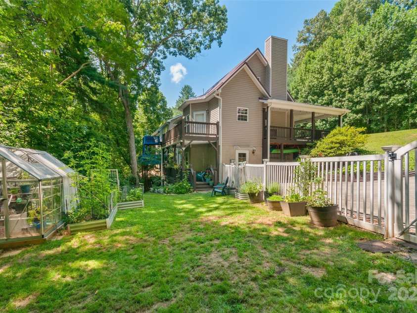 28 Grove Garden Avenue, Candler, NC 28715.  MLS# CAR4278254, YatesRealty ID 26090. House from fenced in back yard