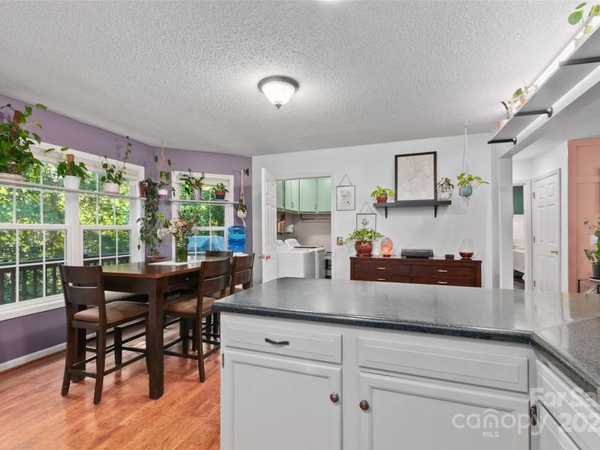 28 Grove Garden Avenue, Candler, NC 28715.  MLS# CAR4278254, YatesRealty ID 26090. Kitchen into dining area