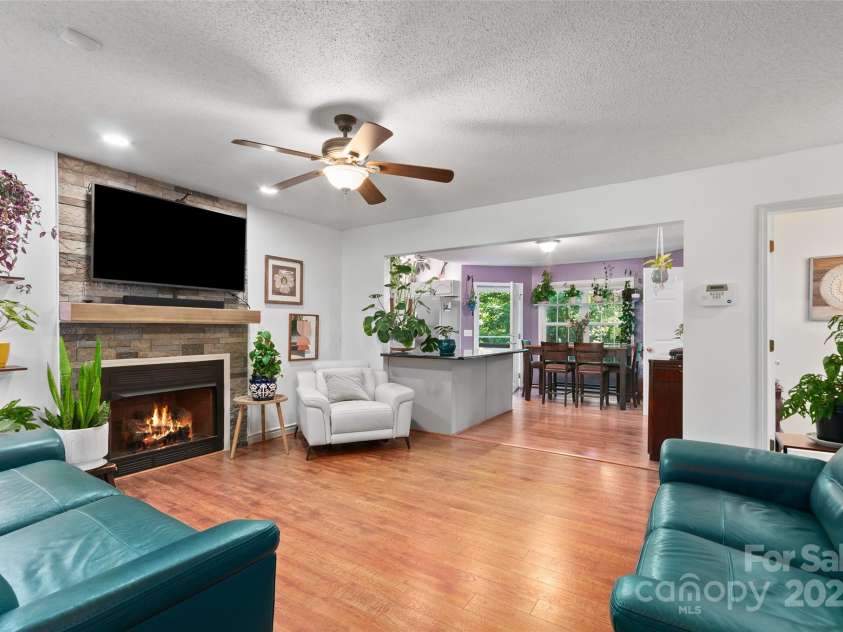 28 Grove Garden Avenue, Candler, NC 28715.  MLS# CAR4278254, YatesRealty ID 26090. Living toward kitchen and dining