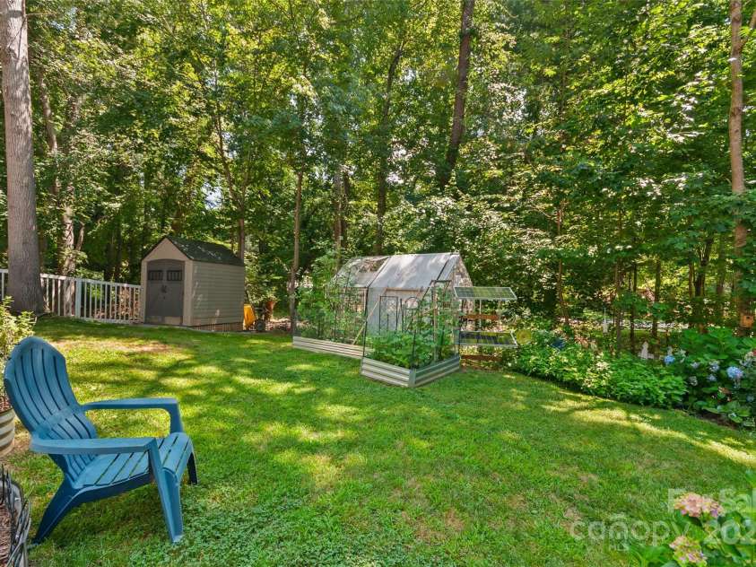 28 Grove Garden Avenue, Candler, NC 28715.  MLS# CAR4278254, YatesRealty ID 26090. Lush landscaping in back yard (fenced)