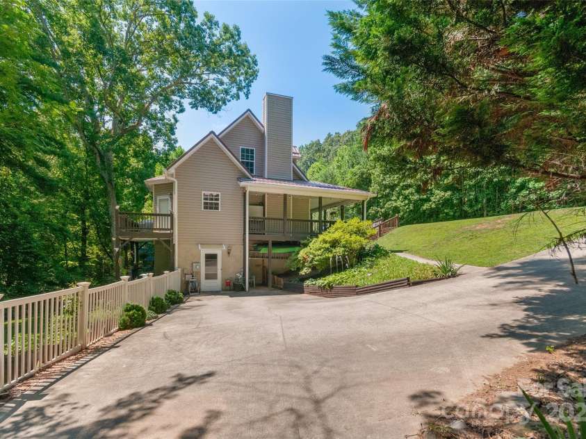 28 Grove Garden Avenue, Candler, NC 28715.  MLS# CAR4278254, YatesRealty ID 26090. Side view from driveway (outside entrance to downstairs living quaters)