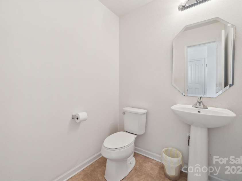 3512 Gibbon Terrace Court, Charlotte, NC 28269.  MLS# CAR4261541, YatesRealty ID 26093. Downstairs half bath