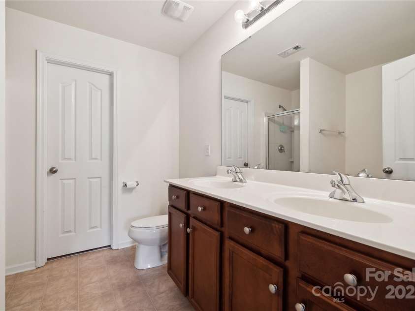 3512 Gibbon Terrace Court, Charlotte, NC 28269.  MLS# CAR4261541, YatesRealty ID 26093. Primary Bathroom and the walk-in closet