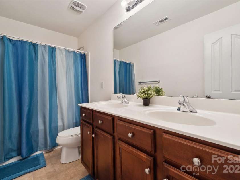 3512 Gibbon Terrace Court, Charlotte, NC 28269.  MLS# CAR4261541, YatesRealty ID 26093. Second floor full bath with dual vanity