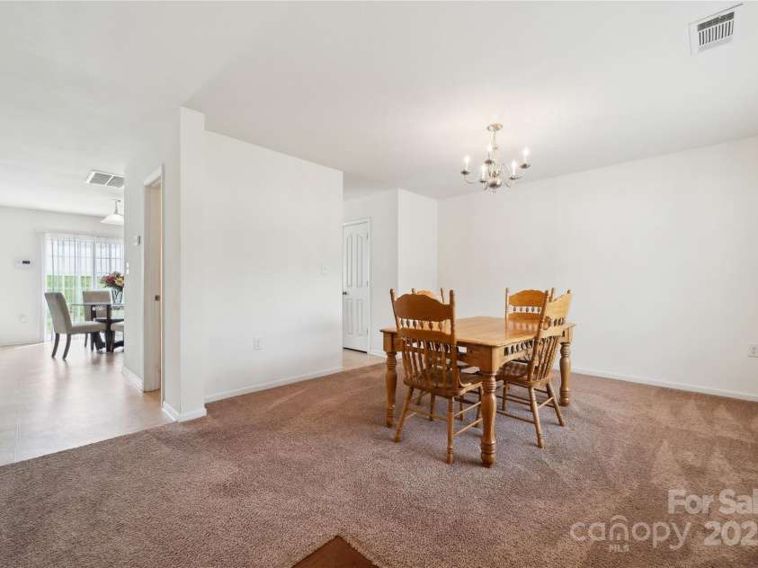 3512 Gibbon Terrace Court, Charlotte, NC 28269.  MLS# CAR4261541, YatesRealty ID 26093. Spacious Dining room upon entering the home