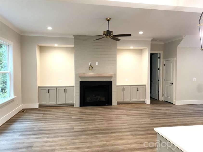 179 Chaska Loop, Troutman, NC 28166.  MLS# CAR4386501, YatesRealty ID 26098. Great Room- Fireplace, Built-ins