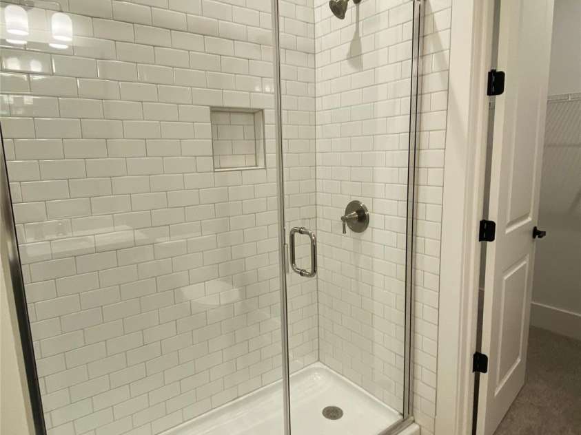 179 Chaska Loop, Troutman, NC 28166.  MLS# CAR4386501, YatesRealty ID 26098. Guest Shower on Main
