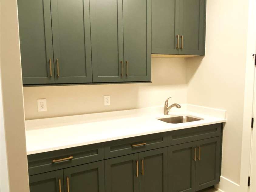 179 Chaska Loop, Troutman, NC 28166.  MLS# CAR4386501, YatesRealty ID 26098. Laundry Room Sink & Folding Area