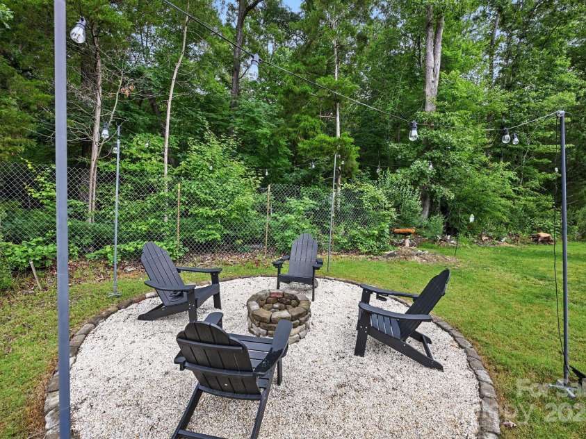 3951 Tersk Drive, Midland, NC 28107.  MLS# CAR4266574, YatesRealty ID 26109. Backyard fire pit area