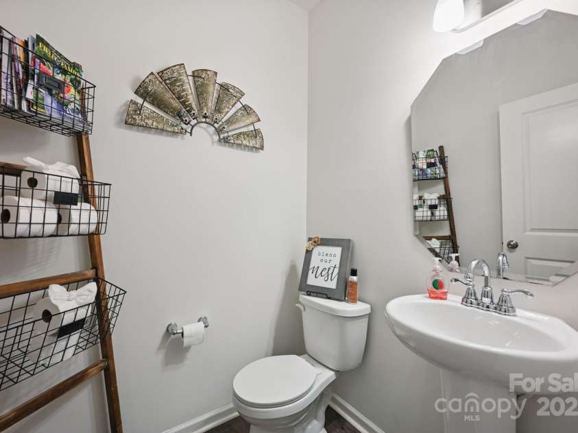 3951 Tersk Drive, Midland, NC 28107.  MLS# CAR4266574, YatesRealty ID 26109. Downstairs Hallway Half Bathroom