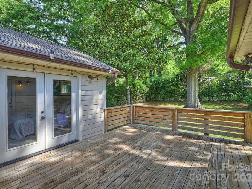 1522 Barberry Court, Charlotte, NC 28211.  MLS# CAR4258498, YatesRealty ID 2611. Access the spacious deck through French doors from the primary suite overlooking a flat, fully fenced backyard.