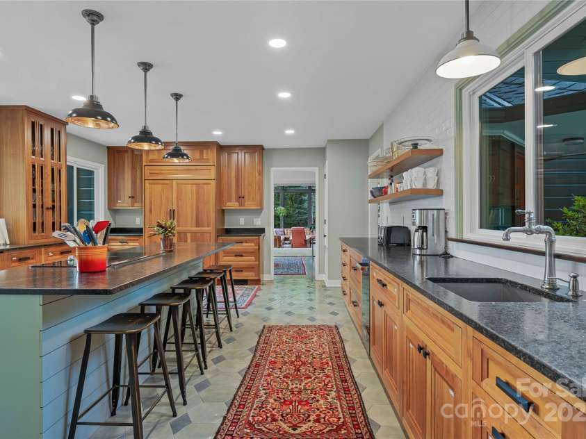 400 Kings Drive, Lake Lure, NC 28746.  MLS# CAR4264882, YatesRealty ID 2612. Chefs entertaining kitchen overlooking sunrise views over the east pasture.