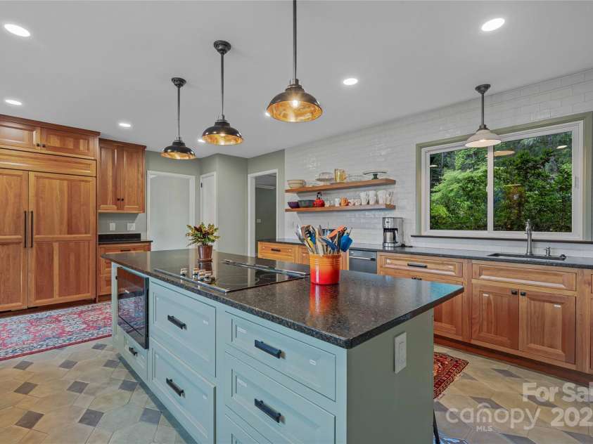 400 Kings Drive, Lake Lure, NC 28746.  MLS# CAR4264882, YatesRealty ID 2612. Sub Zero Cabinet Style refrigerator with leathered granite counters with plenty of storage for your every need. 