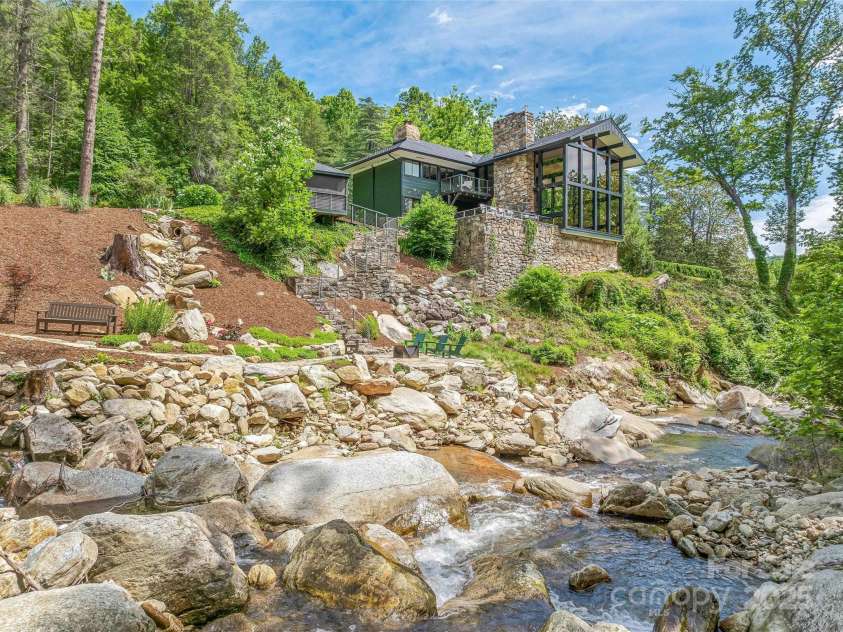 400 Kings Drive, Lake Lure, NC 28746.  MLS# CAR4264882, YatesRealty ID 2612. The main home is poised above the beautiful creek with pure mountain water.