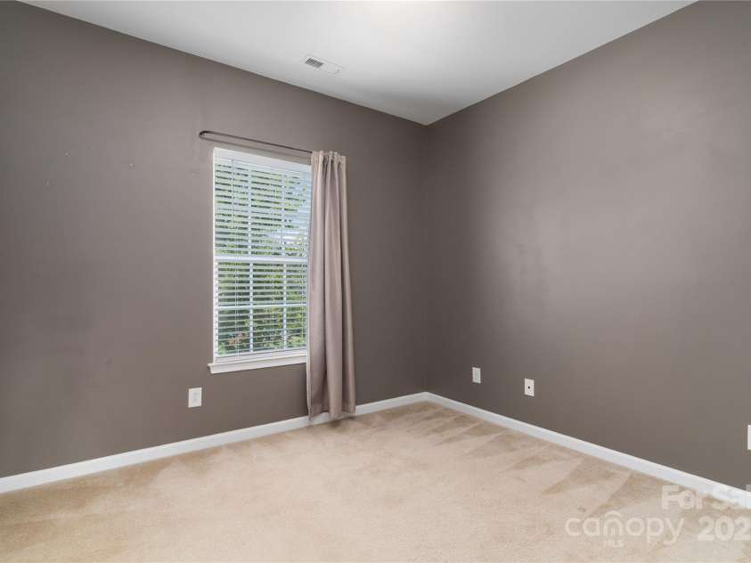 1027 Writers Way, Cornelius, NC 28031.  MLS# CAR4275170, YatesRealty ID 26124. Bedroom 2 different angle.