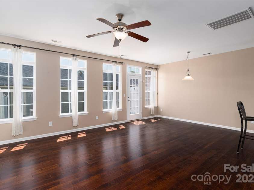 1027 Writers Way, Cornelius, NC 28031.  MLS# CAR4275170, YatesRealty ID 26124. Great Room walks out into the courtyard.