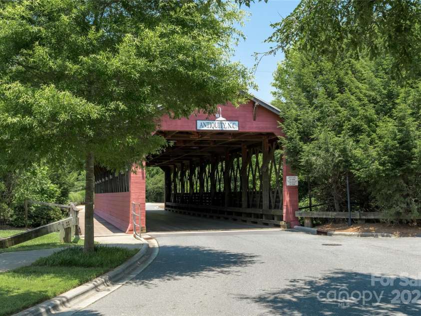 1027 Writers Way, Cornelius, NC 28031.  MLS# CAR4275170, YatesRealty ID 26124. Stroll over the covered bridge to Davidson.