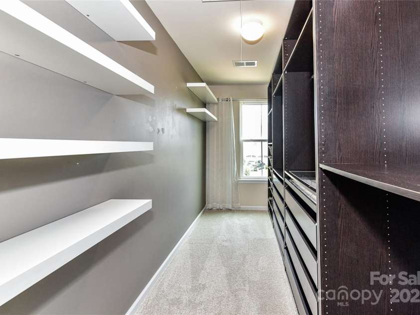 3533 Catherine Creek Place, Davidson, NC 28036.  MLS# CAR4279633, YatesRealty ID 26125. Amazing Primary Closet with custom built in shelving/drawers!