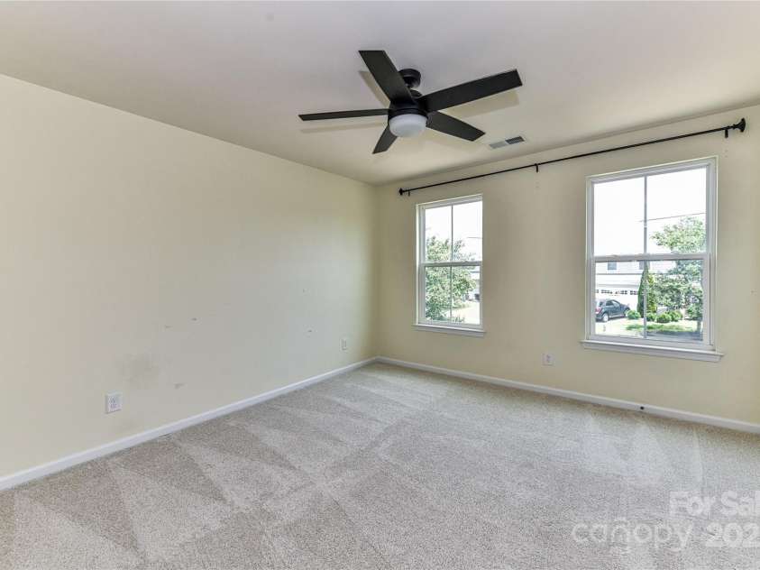 3533 Catherine Creek Place, Davidson, NC 28036.  MLS# CAR4279633, YatesRealty ID 26125. Spacious Bedroom 4 on upper level with ceiling fan/light!