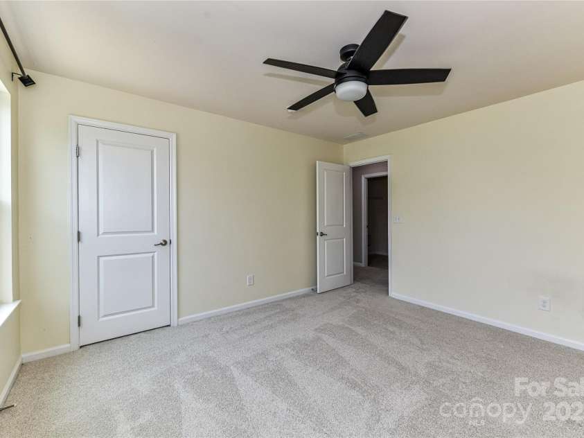 3533 Catherine Creek Place, Davidson, NC 28036.  MLS# CAR4279633, YatesRealty ID 26125. Spacious Bedroom 4 on upper level with ceiling fan/light!