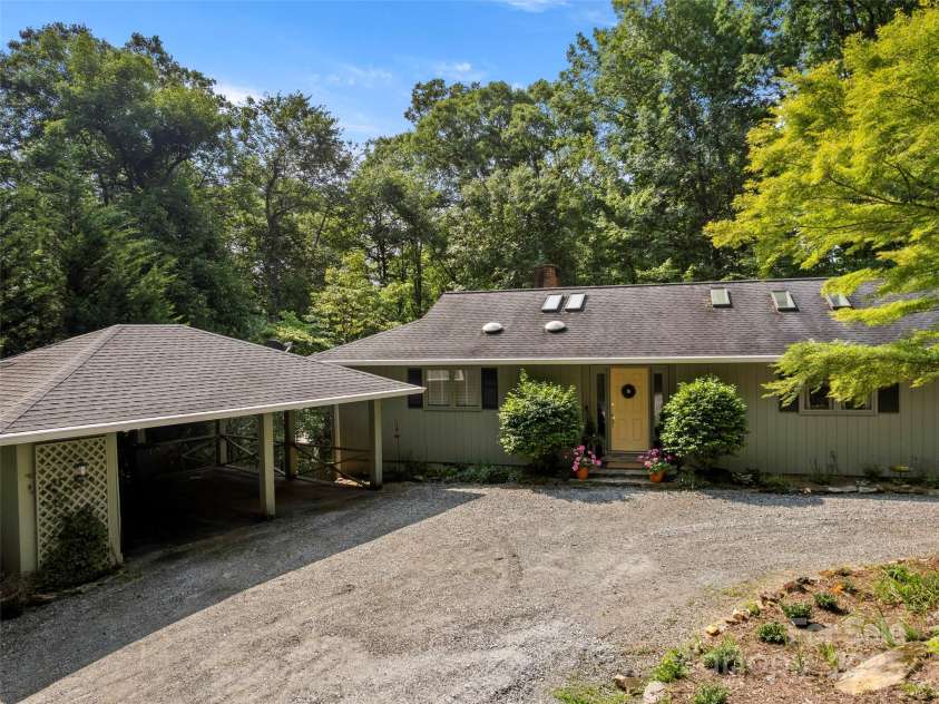 64 Wells Lane, Tryon, NC 28782.  MLS# CAR4277197, YatesRealty ID 26131. Carport and Main Entrance