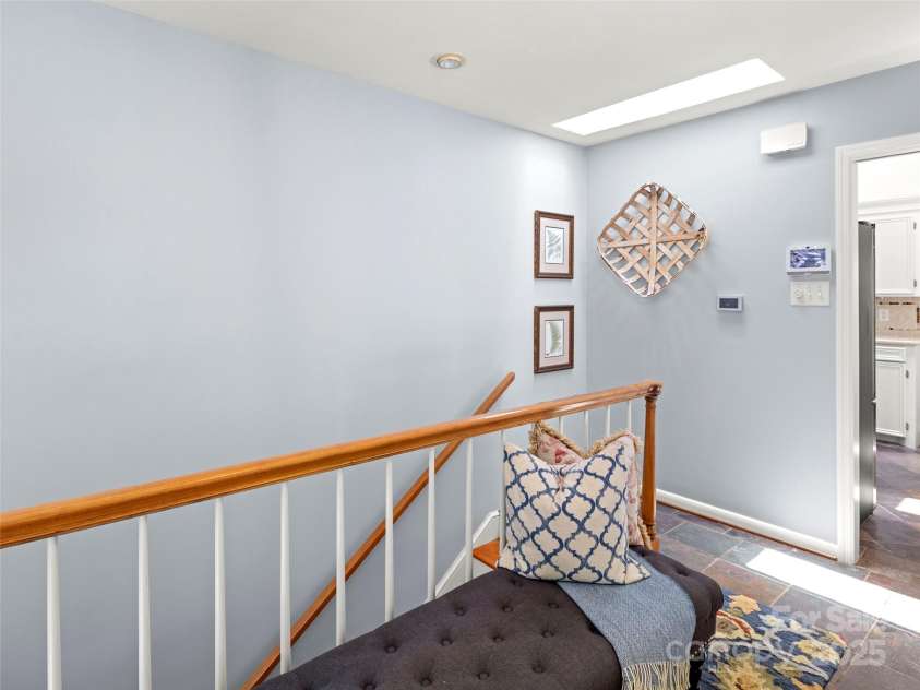 64 Wells Lane, Tryon, NC 28782.  MLS# CAR4277197, YatesRealty ID 26131. Foyer and Stairs to the Lower Level