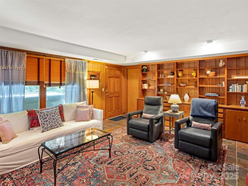 64 Wells Lane, Tryon, NC 28782.  MLS# CAR4277197, YatesRealty ID 26131. Lower Level Family Room