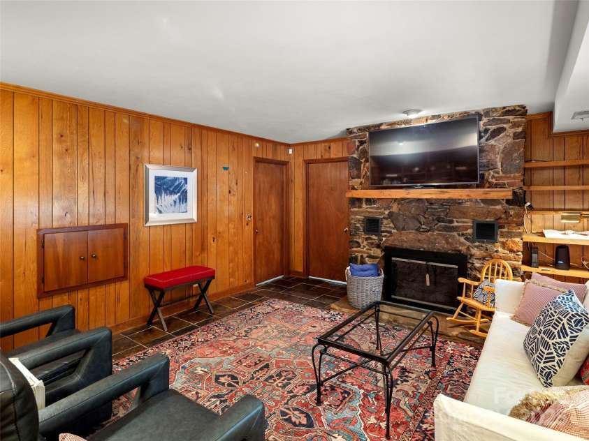 64 Wells Lane, Tryon, NC 28782.  MLS# CAR4277197, YatesRealty ID 26131. Lower Level Family Room