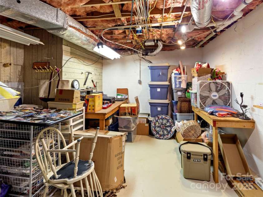 64 Wells Lane, Tryon, NC 28782.  MLS# CAR4277197, YatesRealty ID 26131. Lower Level Storage Room
