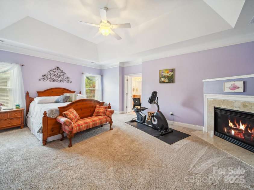 6523 Alba Rose Lane, Huntersville, NC 28078.  MLS# CAR4270008, YatesRealty ID 26142. Primary Bedroom with Fireplace