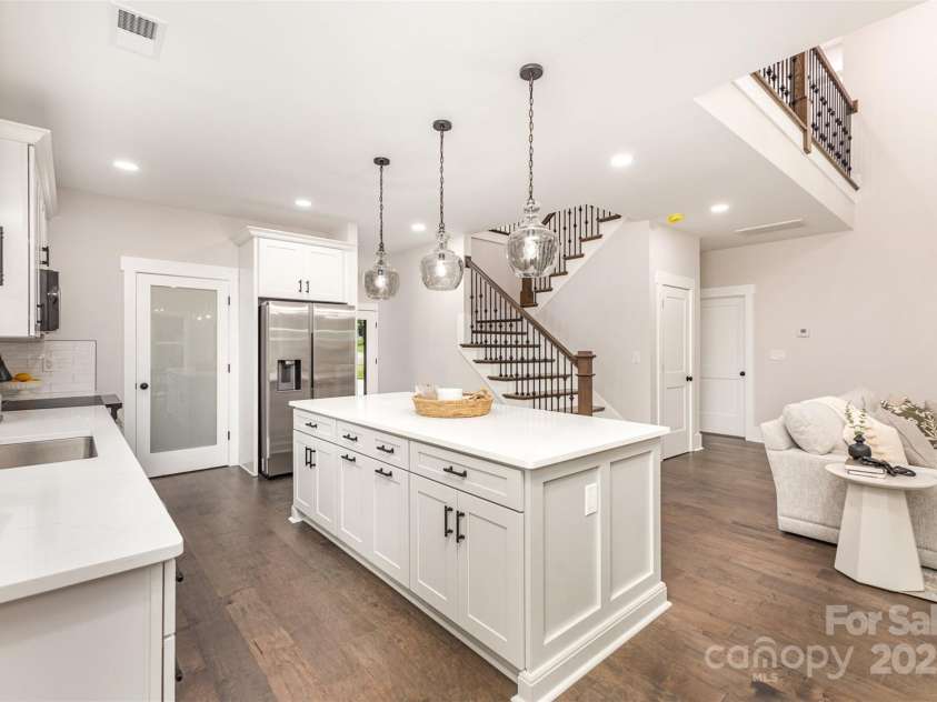 9527 Walkers Ferry Road, Charlotte, NC 28214.  MLS# CAR4255253, YatesRealty ID 26145. Kitchen offers a walk-in pantry with custom wood shelving