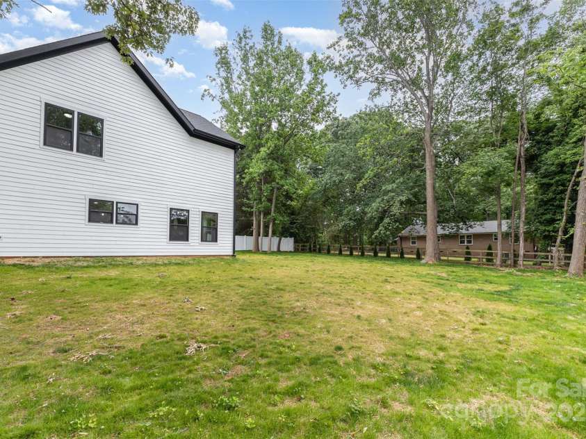 9527 Walkers Ferry Road, Charlotte, NC 28214.  MLS# CAR4255253, YatesRealty ID 26145. Landscape already planted for back yard line privacy