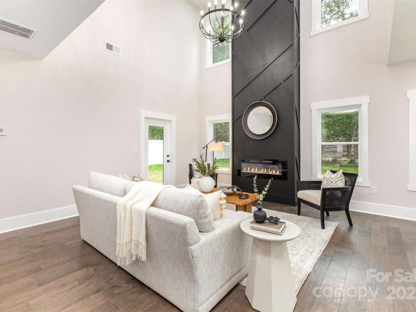 9527 Walkers Ferry Road, Charlotte, NC 28214.  MLS# CAR4255253, YatesRealty ID 26145. The centerpiece 2-story fireplace anchors the living space