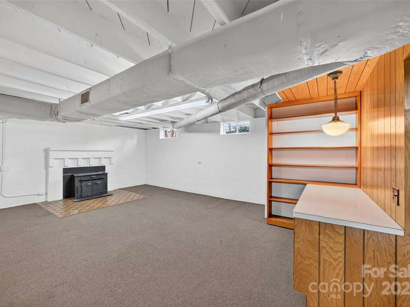 337 Main Street, Rockwell, NC 28138.  MLS# CAR4325741, YatesRealty ID 26150. Basement Woodstove