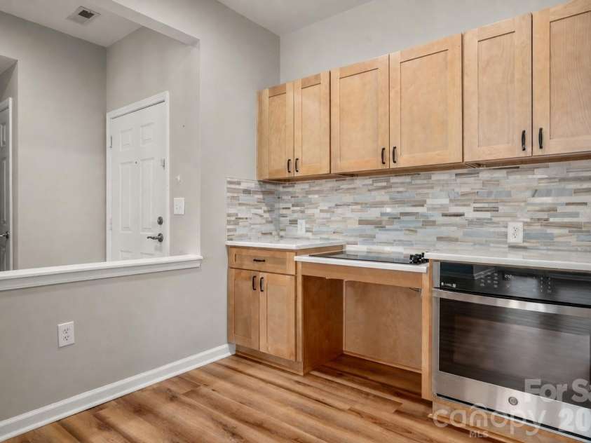 6112 Creft Circle, Indian Trail, NC 28079.  MLS# CAR4416294, YatesRealty ID 26151. Kitchen with front door on the left