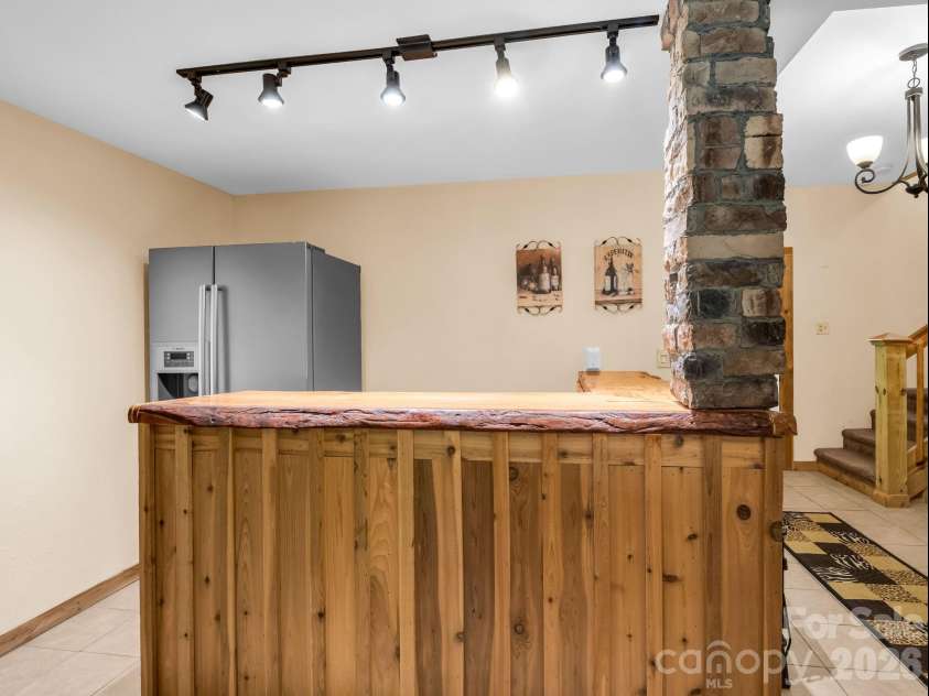 165 Dream Road, Hendersonville, NC 28792.  MLS# CAR4383909, YatesRealty ID 26155. Bar on lower level.