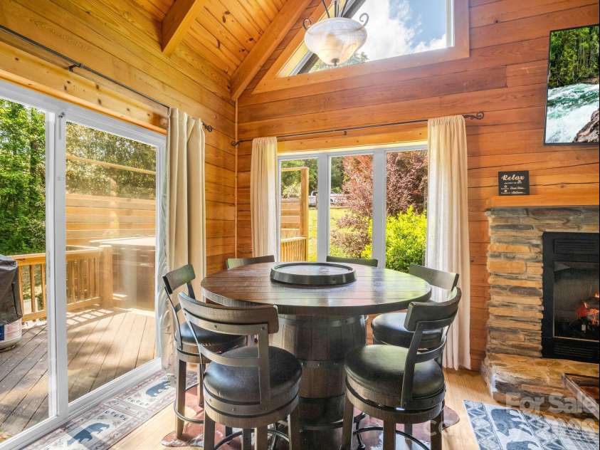 165 Dream Road, Hendersonville, NC 28792.  MLS# CAR4383909, YatesRealty ID 26155. Dining Area for 6 at this bourbon barrel table.
