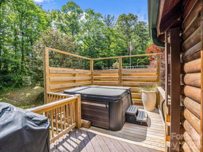 165 Dream Road, Hendersonville, NC 28792.  MLS# CAR4383909, YatesRealty ID 26155. Hot tub on back deck provides privacy.