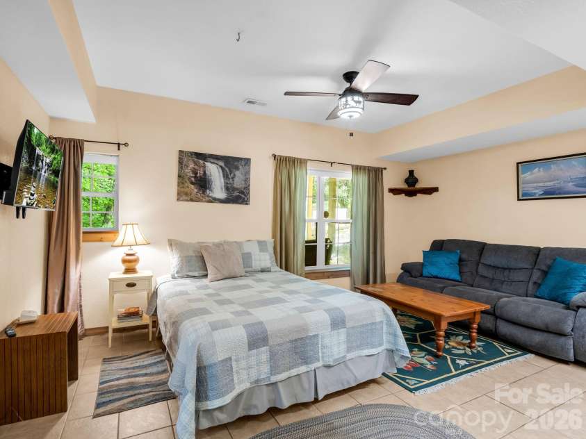 165 Dream Road, Hendersonville, NC 28792.  MLS# CAR4383909, YatesRealty ID 26155. Lower level provides extra space for guests, TV away from the main area, multi-generational living.