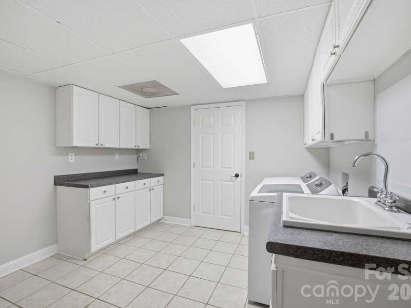 424 Mountain Harbor Drive, Lexington, NC 27292.  MLS# CAR4380660, YatesRealty ID 26156. Laundry room in basement