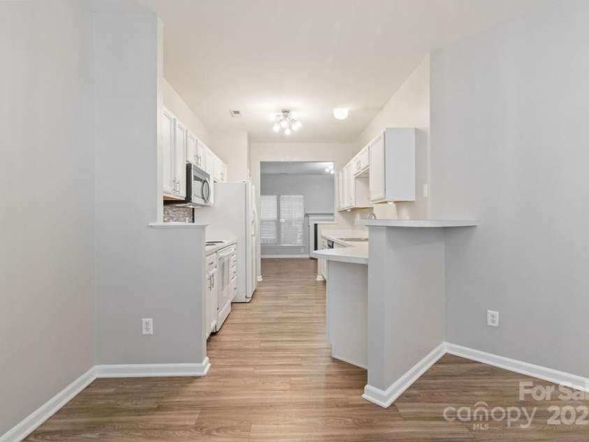 12207 Jessica Place, Charlotte, NC 28269.  MLS# CAR4235868, YatesRealty ID 26157. Dining area looking into kitchen