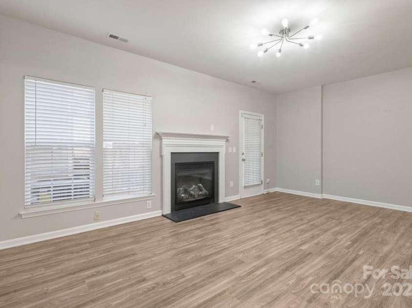 12207 Jessica Place, Charlotte, NC 28269.  MLS# CAR4235868, YatesRealty ID 26157. From kitchen to living room