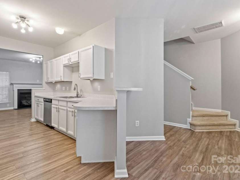 12207 Jessica Place, Charlotte, NC 28269.  MLS# CAR4235868, YatesRealty ID 26157. In Dining area looking at kitchen and hall access