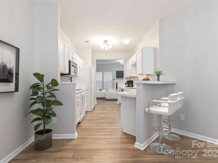 12207 Jessica Place, Charlotte, NC 28269.  MLS# CAR4235868, YatesRealty ID 26157. Virtual Staged Galley Kitchen