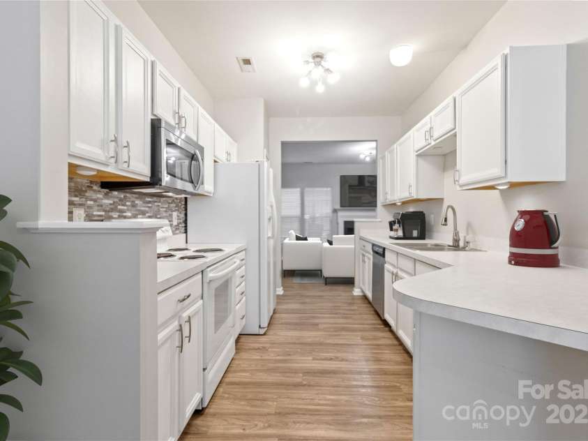 12207 Jessica Place, Charlotte, NC 28269.  MLS# CAR4235868, YatesRealty ID 26157. Virtual Staged Galley Kitchen