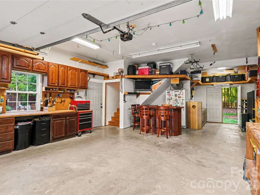 10428 South Hall Drive, Charlotte, NC 28270.  MLS# CAR4383038, YatesRealty ID 26160. Extra large 2 car garage. (Bar does not convey)
