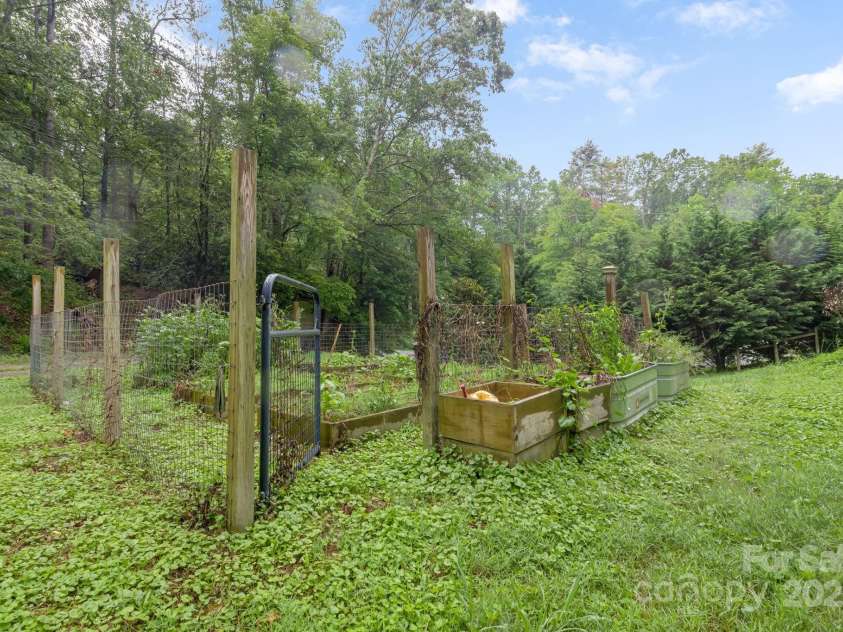 465 Youngs Gap Road, Fletcher, NC 28732.  MLS# CAR4275186, YatesRealty ID 26162. Raised beds