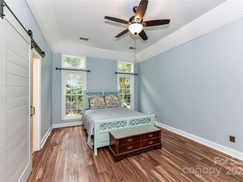 10213 Conistan Place, Cornelius, NC 28031.  MLS# CAR4223056, YatesRealty ID 26169. Light-filled Primary Bedroom with LVP floors