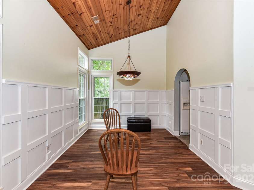 10213 Conistan Place, Cornelius, NC 28031.  MLS# CAR4223056, YatesRealty ID 26169. Spacious Dining Room with beautiful woodwork and arched doorway